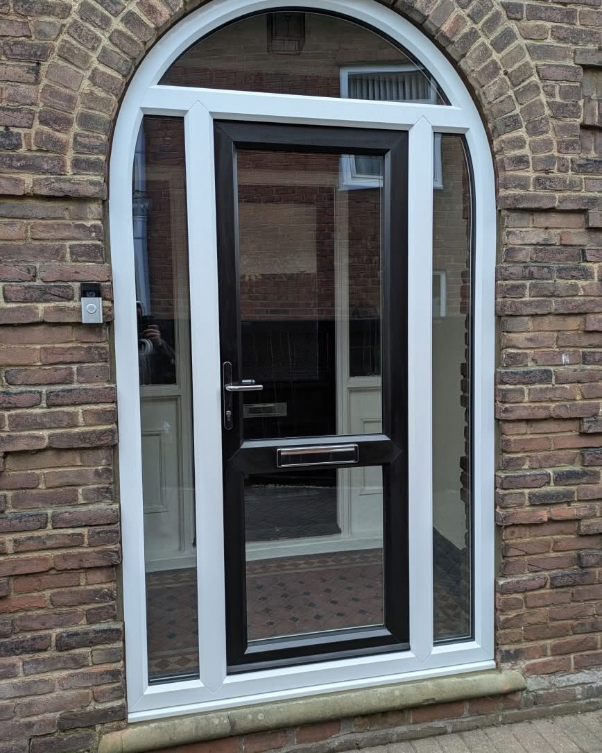 PTF glazed entrance door within traditional arched brickwork