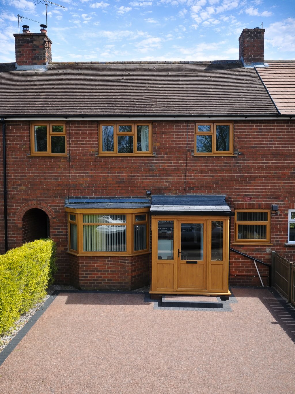 Irish Oak windows and matching porch on a brick property